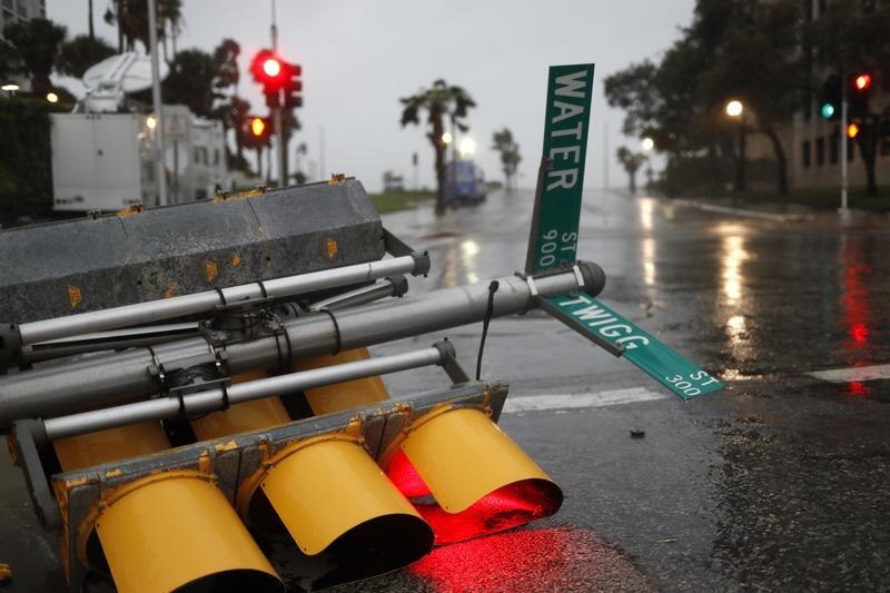 Traffic lights lie on a street after being knocked down,