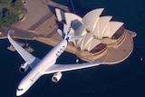 an plane flying over the harbour