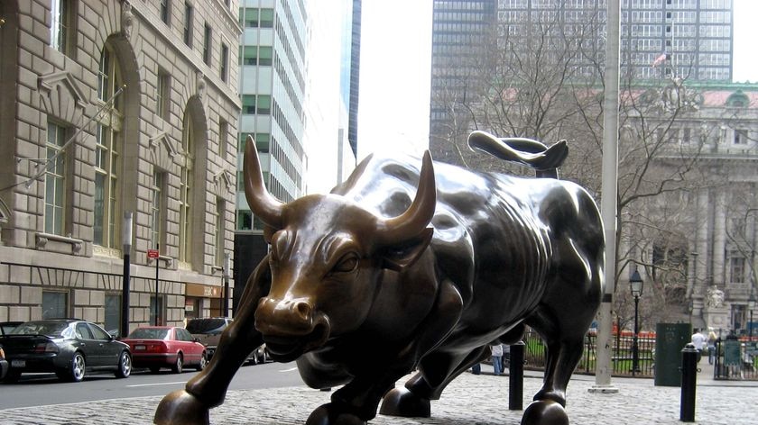 Bronze sculpture of a charging bull on Wall Street, in New York.