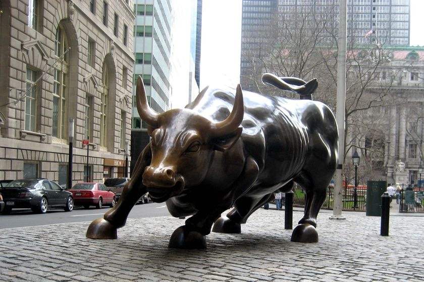 Bronze sculpture of a charging bull on Wall Street, in New York.