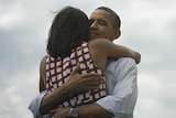 Barack and Michelle Obama embrace