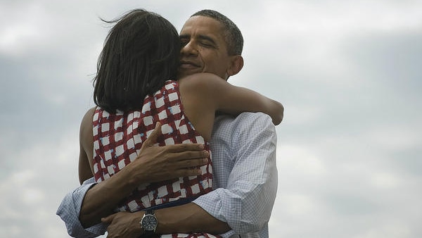 Barack and Michelle Obama embrace