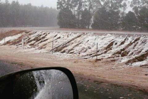 A dam overflows on Graphite Road in Manjimup, Western Australia, 18 January.