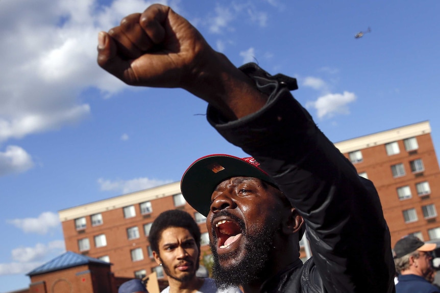 Demonstrators in Baltimore after the city was looted