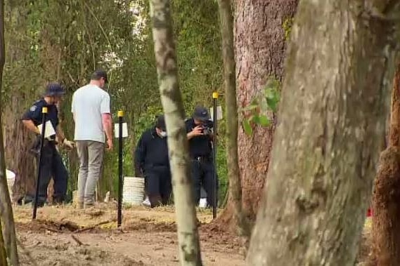 police take photo of a location on the ground