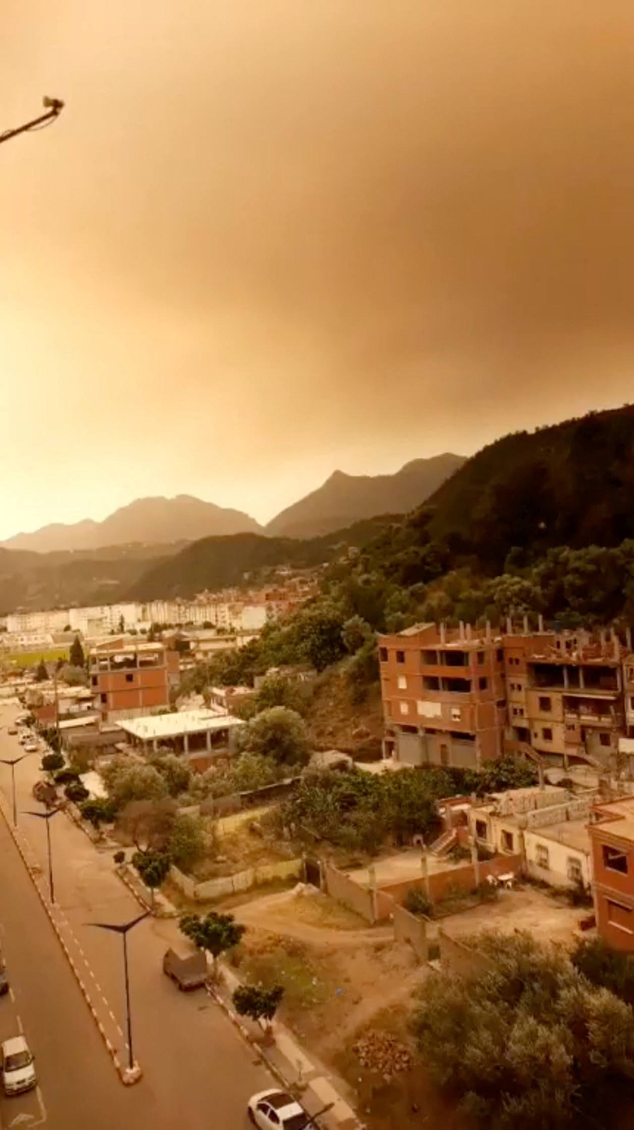 Smoke rises following a wildfire in Bejaia, Algeria.