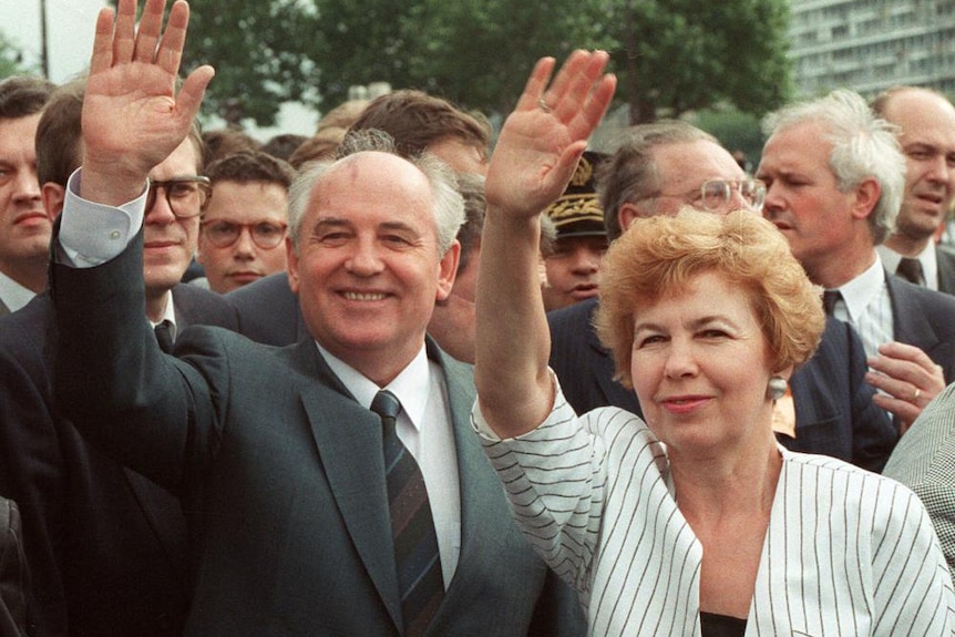 Mikhail Gorbachev and his wife, Raisa, wave to a crowd during their visit in Paris.