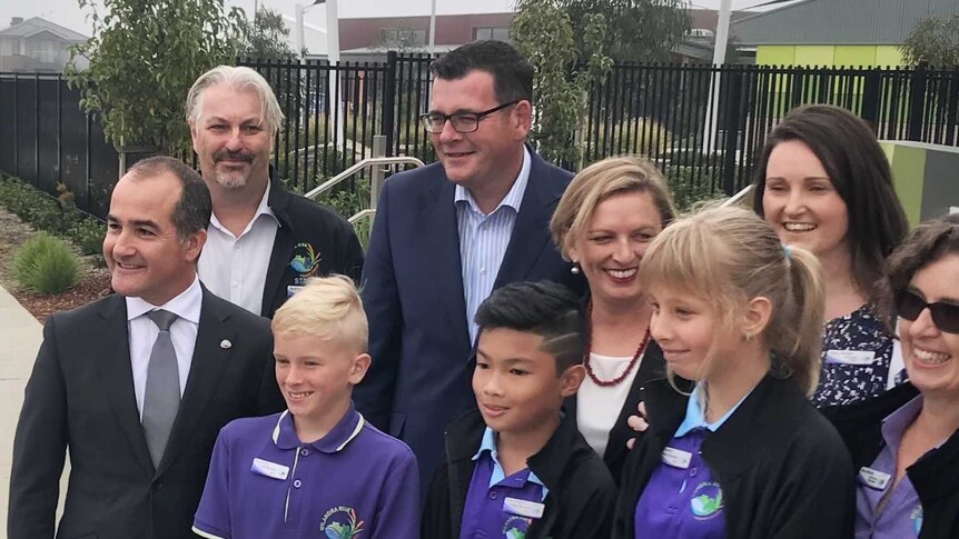 The Premier and Education Minister pose for a photo with primary school students.