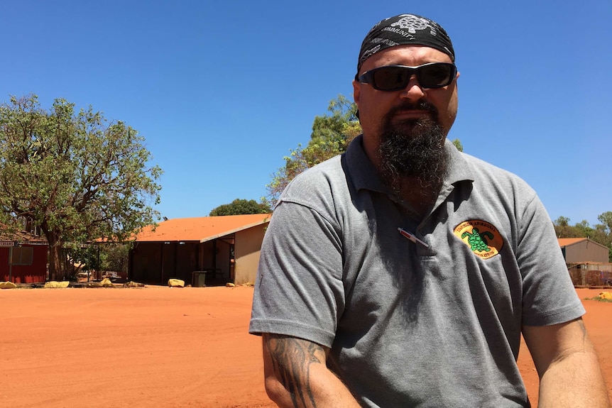 Djarindjin CEO Nathan McIvor standing in front of a house at Djarindjin Community