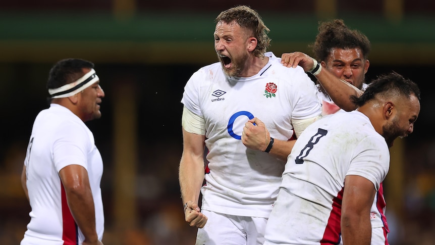 England rugby union players scream and shout in jubilation after a win in a big Test match against Australia. 