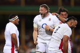 England rugby union players scream and shout in jubilation after a win in a big Test match against Australia. 