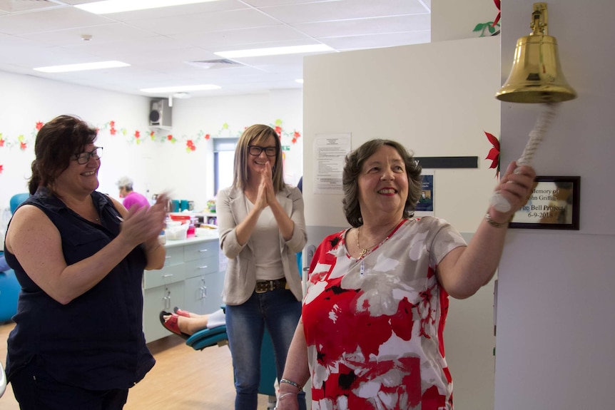 Lynette Morgan rings the bell in the chemotherapy outpatient unit
