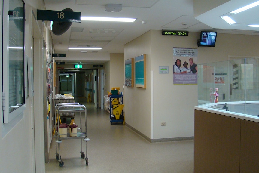 An empty hallway in a hospital.
