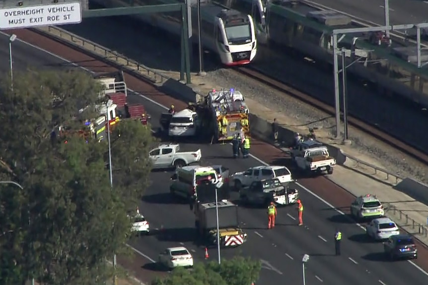 An aerial shot of a crash on the Mitchell Freeway in West Leederville with emergency vehicles at the scene.