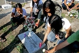 Relatives of victims light candles at Ampatuan massacre site