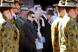The fiancee (centre) of soldier Private Nathan Bewes mourns