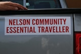 A picture of a bumper sticker that reads: Nelson Community Essential Traveller
