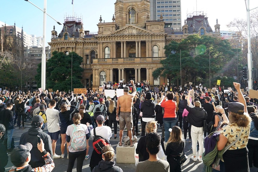 A group of people outside Town Hall.