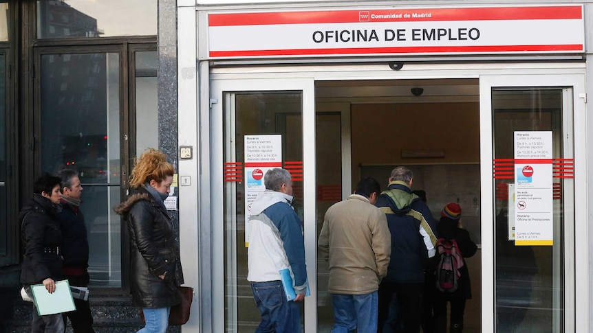 People enter a government-run employment office in Madrid