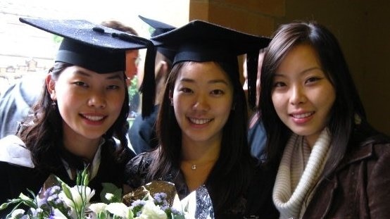 Susan (middle) poses with friends on her graduation day