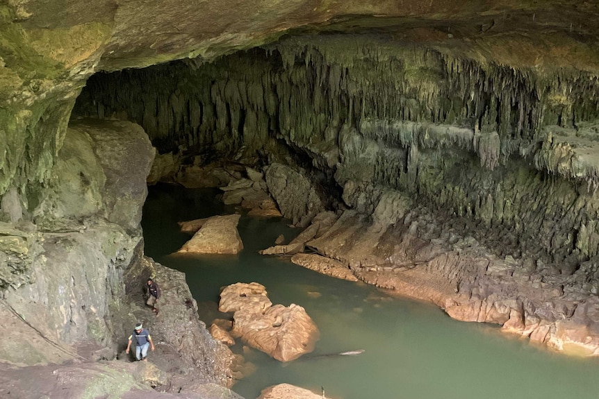 A large cave with a creek running through it is the site of an archaeological dig in Papua New Guinea.