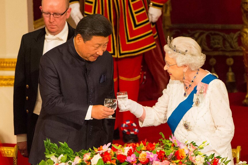 President of China Xi Jinping and Britain's Queen Elizabeth II attend a state banquet at Buckingham Palace.