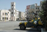 An armoured military vehicle is parked on a main street of the Syrian city of Hama on August 11, 2011.