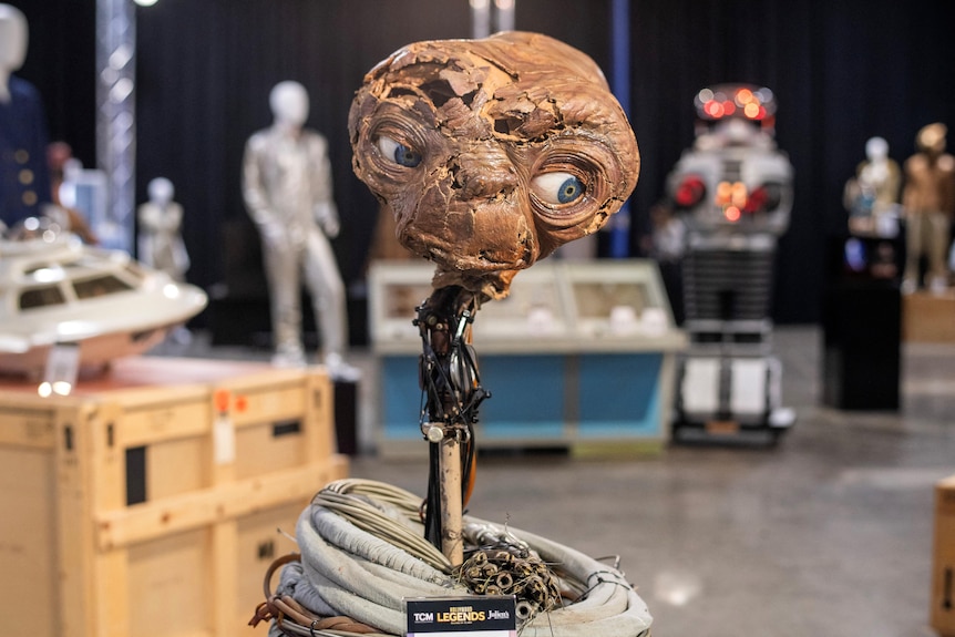 The special effects head of E.T. is displayed during an auction.