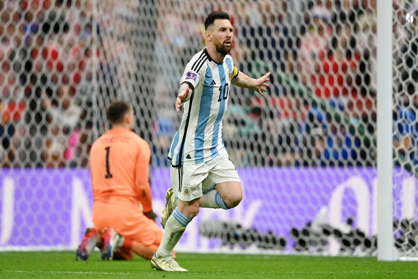 Argentina's Lionel Messi runs away with arms outstretched after scoring a goal against Croatia in the FIFA World Cup semifinal.