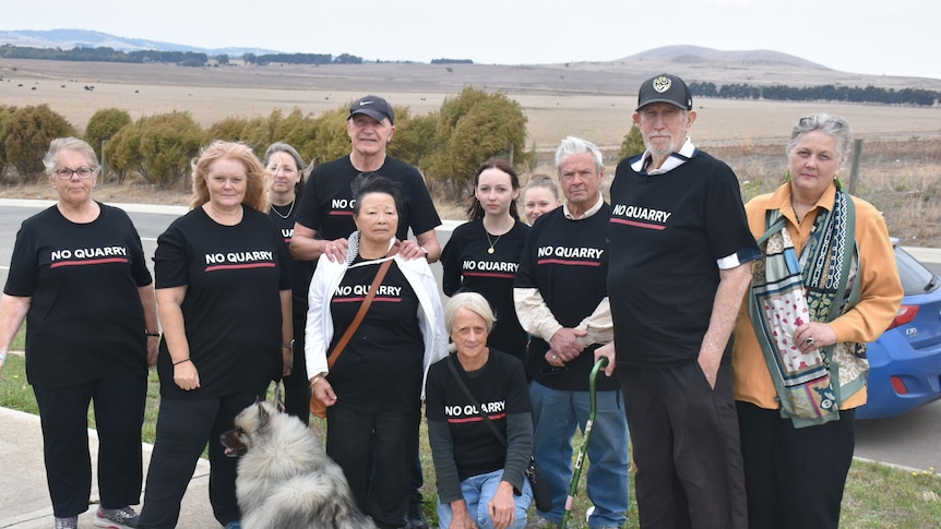 A group of people wearing 'no quarry' shirts.