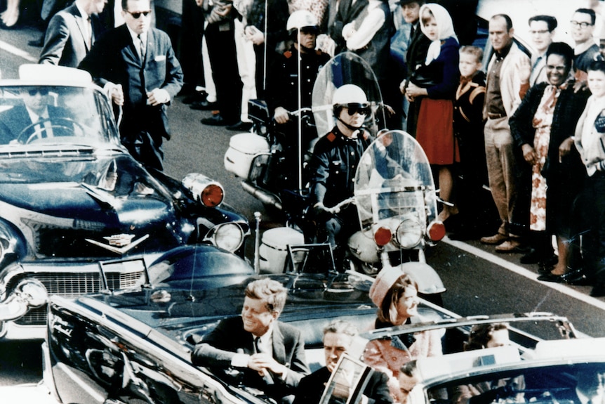 John F Kennedy's motorcade in Dallas, Texas before his 1963 assassination