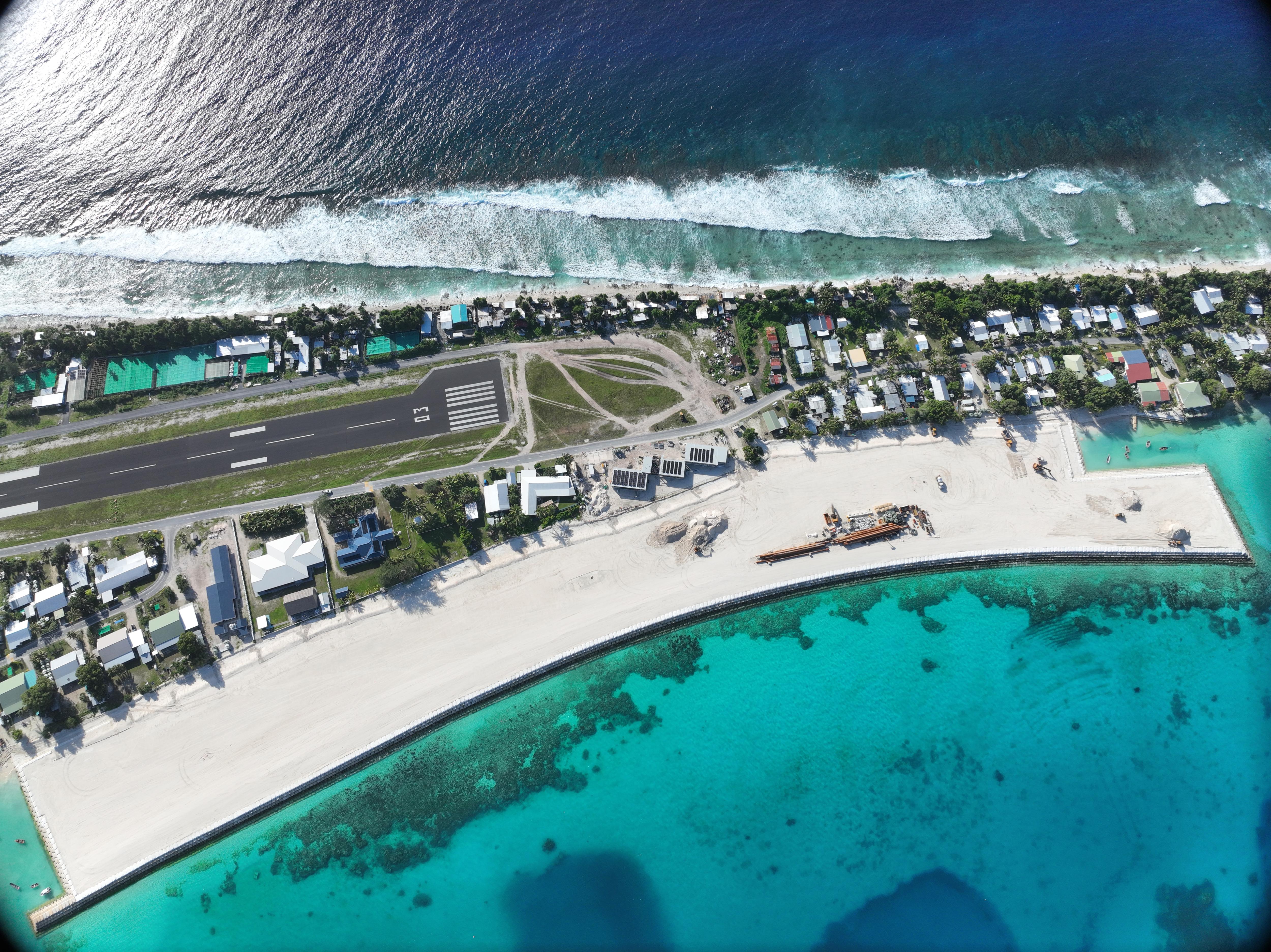 An aerial shot of the land reclamation project shows new land built in relation to the airport.