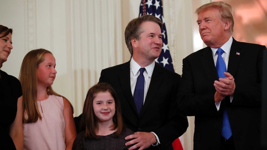 Brett Kavanaugh and his family stand alongside Donald Trump