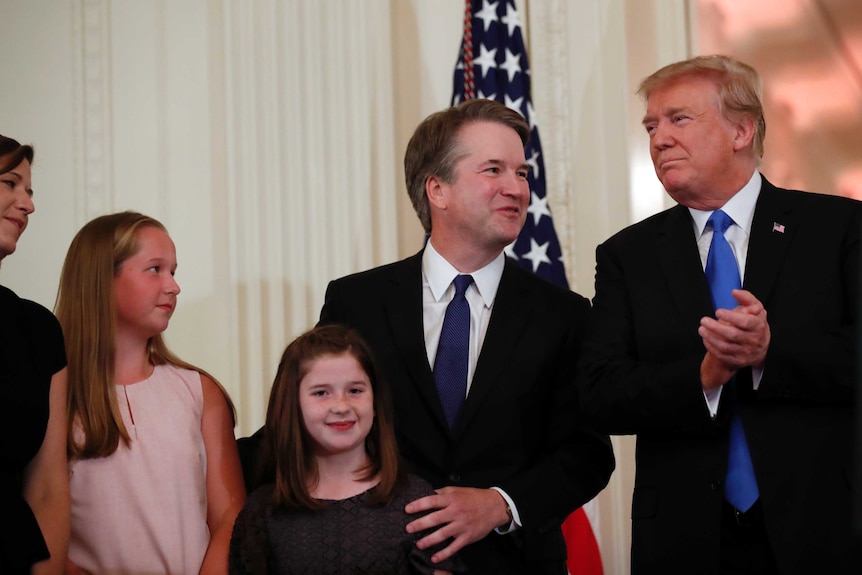 Brett Kavanaugh and his family stand alongside Donald Trump