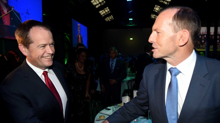 Prime Minister Tony Abbott and Opposition Leader Bill Shorten shake hands