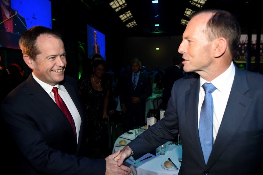 Prime Minister Tony Abbott and Opposition Leader Bill Shorten shake hands