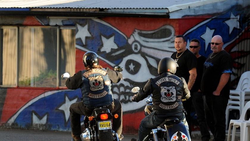 Members of the Lone Wolf Motorcycle Club arrive at the Rebels Motorcycle clubhouse gates