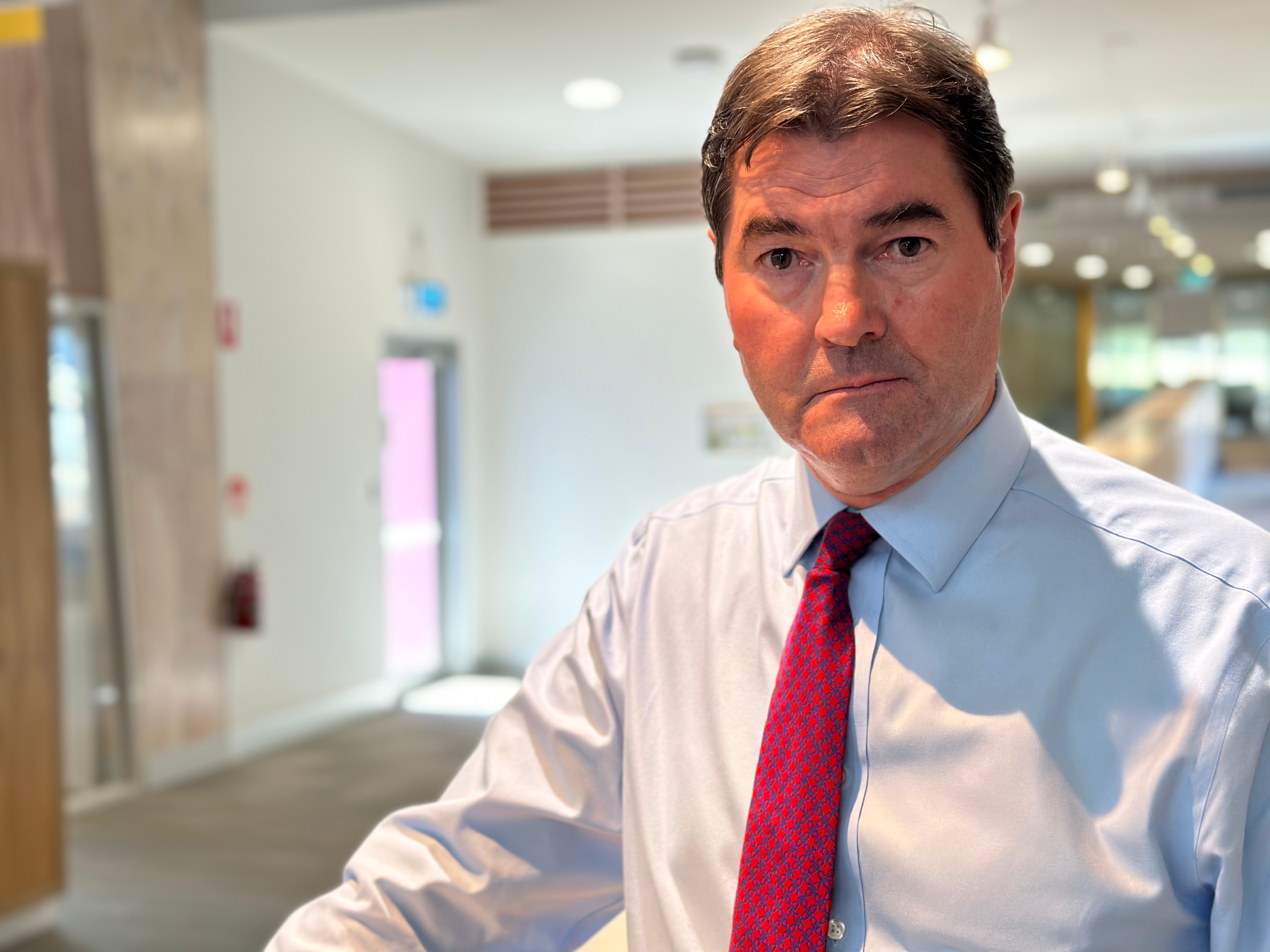 a man stands in an office 