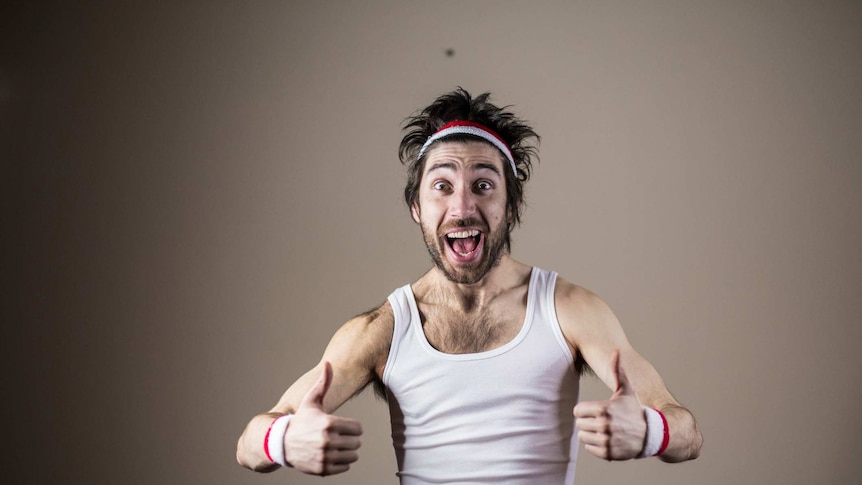 Funny male sports nerd posing with thumbs up