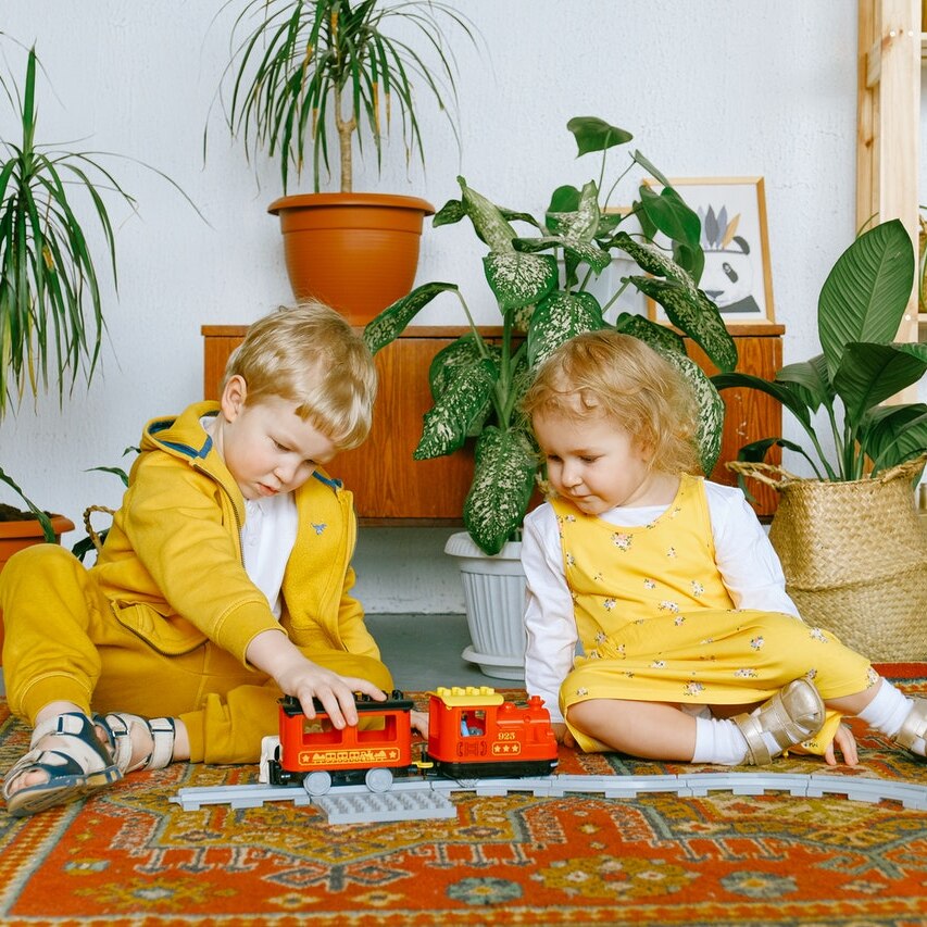 Children playing with toys on the floor