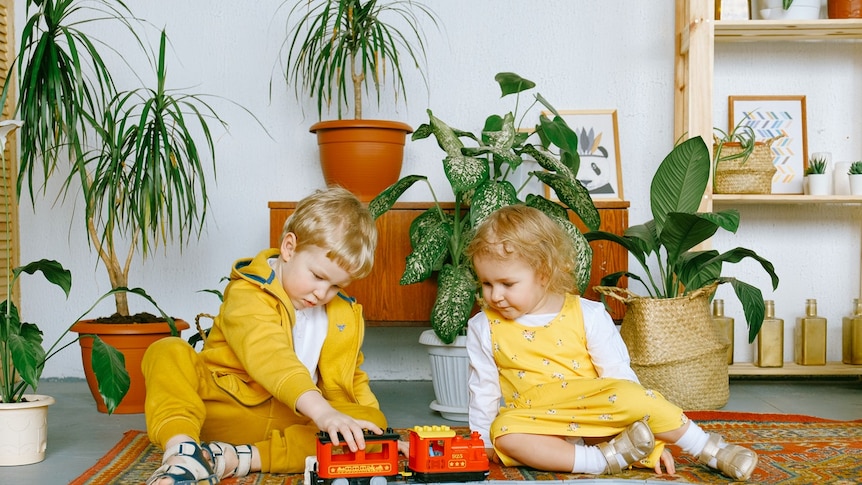 Children playing with toys on the floor