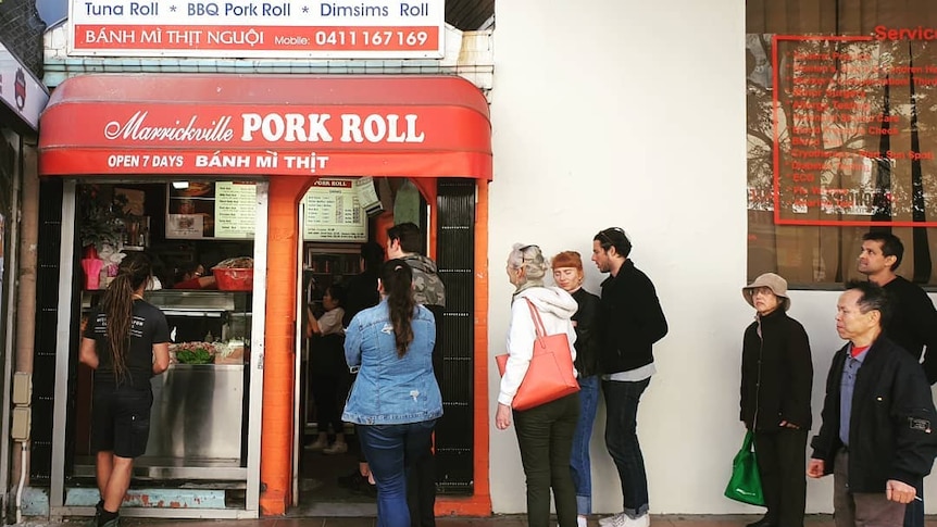 people lining outside a pork roll shop
