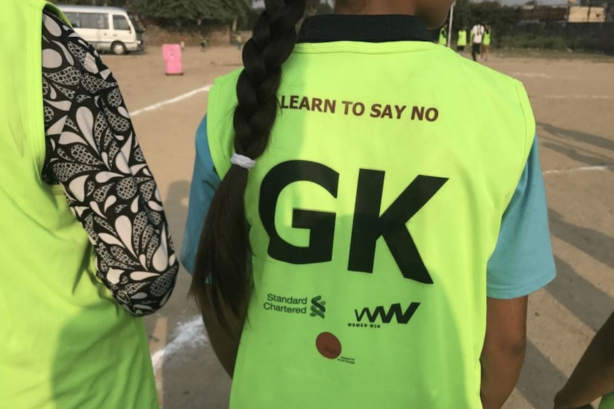 On the back of the playing vests are messages reinforcing life lessons.