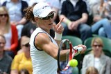 No expectations ... Samantha Stosur plays a shot during her first-round match against Carla Suarez Navarro