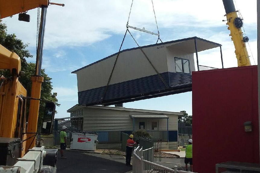 Demountable classroom lifted by crane at Montello Primary School, Tasmania, 2018.