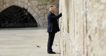 US President Donald Trump touches the Western Wall, Judaism's holiest prayer site.