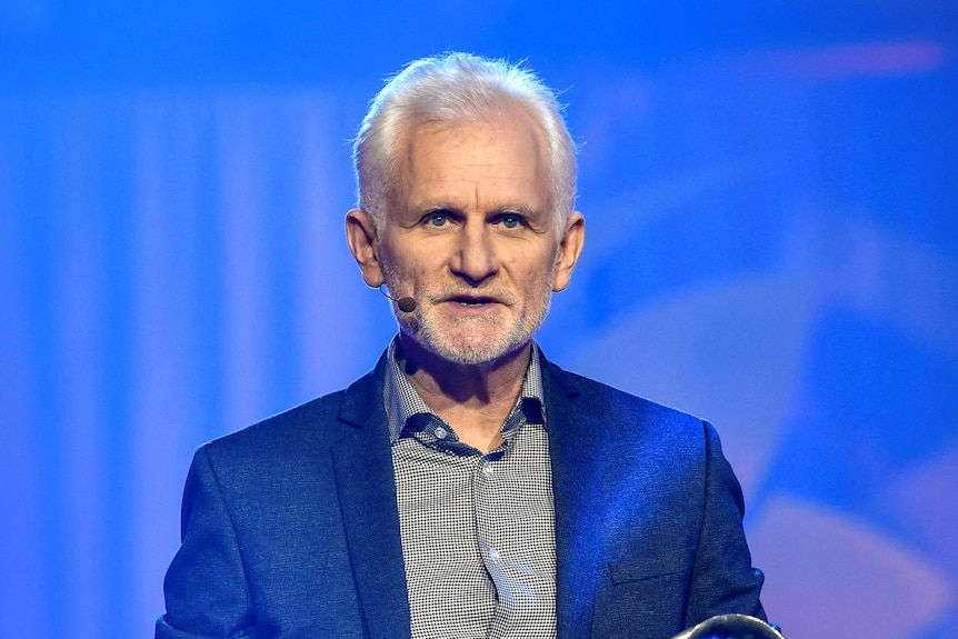 Ales Bialiatski in a suit jacket at an awards ceremony