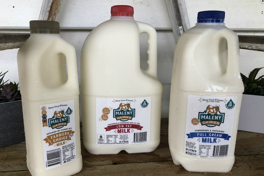 New milk bottles with logo at the top right hand side of the labels.