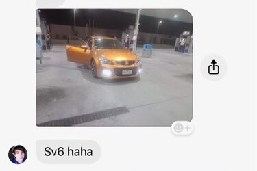 A screenshot of a Facebook message showing an image of an orange car.