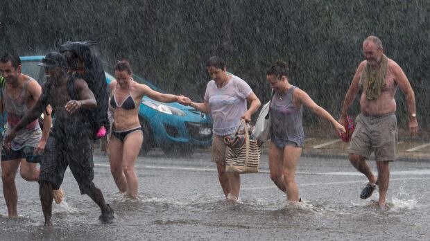 Brighton Beach-goers seek shelter from the rain